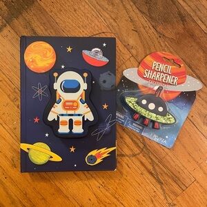 Space notebook and pencil sharpener combo